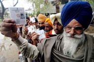 Enthusiastic voters line up in front of a polling station in a rural area of Amritsar district to cast their votes on Tuesday
