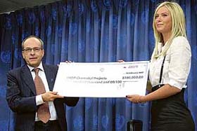 Russian tennis star Maria Sharapova with United Nations Development Programme Associate Administrator Ad Melkert after donating $100,000 for Chernobyl recovery projects in New York