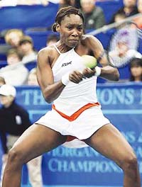 Venus Williams of the USA plays a return to Akiko Morigami of Japan during their first-round match at the Cellular South Cup tennis tournament in Memphis, Tennessee