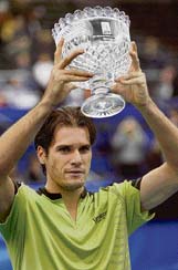 Tommy Haas of Germany holds his trophy after defeating Andy Roddick of the US in the final of the Memphis International tennis tournament in Memphis, Tennessee (USA) on Sunday. Haas won 6-3, 6-2. 