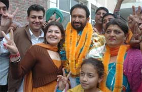 Independent candidate for Ghanaur constituency Madan Lal with his family members celebrates victory in Patiala