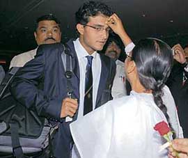 A woman applies �tilak� on the forehead of Sourav Ganguly in Mumbai on Wednesday night, prior to the team�s departure for the West Indies for the cricket World Cup.