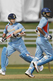 Sachin Tendulkar (left) and Rahul Dravid take a run during a warm-up match against the Netherlands in Trelawny 
