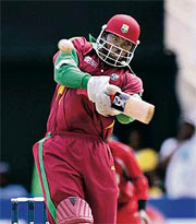 Chris Gayle of the West Indies hits a six against Zimbabwe during their World Cup match in Kingston