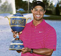 Tiger Woods holds the Gene Sarazen Cup after winning the World Golf Championship at the Doral Golf Resort in Miami on Sunday.