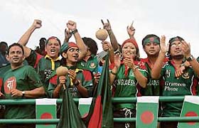 Bangladesh cricket fans celebrate after their team qualified for the Super Eight