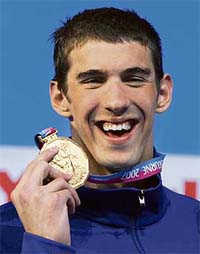 Michael Phelps of the US poses with his gold medal during the awards ceremony for the men�s 200m individual medley final in Melbourne