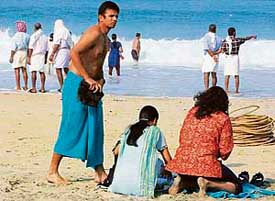 Rahul Dravid relaxes on the beach at Kovalam on Monday. 