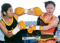 Thai prisoner boxer Samson Sor Siriporn (left) and Japanese boxer Miyano Ayaka fight during their World Boxing Council (WBC) light-flyweight female world boxing championship match.
