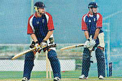 England captain Michael Vaughan (right) and his team-mate Andrew Flintoff bat during a practice session in St. John�s.