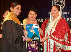Dr Upinderjit Kaur, education minister, Punjab, gives degree to a student during the convocation of BBK DAV College in Amritsar.