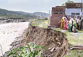 Living on the Edge: Residents of Saila Kulian who have been spending sleepless nights because of the endangering Chakki river in Pathankot