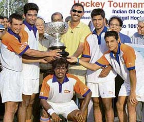 Indian Airlines team, along with captain Dhanraj Pillay (centre), pose with the trophy after they won the 112th All-India Beighton Cup Hockey Tournament in Kolkata