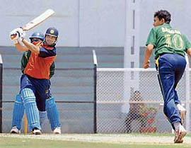 Dinesh Mongia of Punjab plays a shot during the Twenty20 match against Railways at the Brabourne Stadium in Mumbai on Sunday.