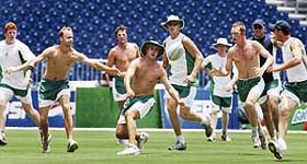 Ireland cricketers warm-up during team training