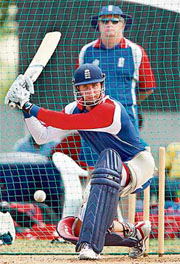 England skipper Michael Vaughan plays a shot while coach Duncan Fletcher looks on during a training session in Bridgetown.