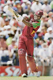Chris Gayle of the West Indies plays a shot against England during the last Super Eight match, in Bridgetown