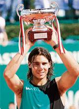 Spain�s Rafael Nadal poses with his trophy after winning against Swiss Roger Federer during their Monte Carlo ATP Masters Series final in Monaco.