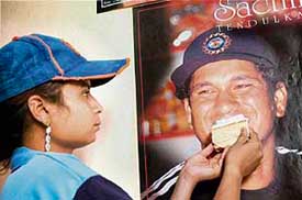 A fan of Sachin Tendulkar celebrates his birthday in Bikaner on Tuesday. 