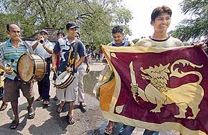 Sri Lankan cricket fans celebrate their team�s win in the World Cup semifinal match against New Zealand, in the streets of Colombo, on Wednesday. 