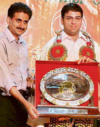 World number one chess player Viswanathan Anand (right) receives a memento from Tamil Nadu Chess Association president PR Venketrama Raja during the diamond jubilee celebrations of the association in Chennai.