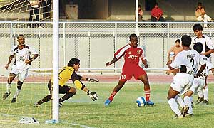 JCT striker Edeh Chidi is about to score the match winner against Mahindra United, Mumbai, in the 11th National Football League at Ludhiana�s Guru Nanak Stadium on Wednesday.