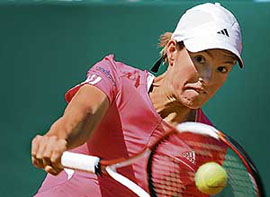 Belgium�s Justine Henin in action against Serbia�s Elena Jankovic in the semifinal of the Warsaw Cup on Saturday. Henin won 7-5, 2-6, 6-4.