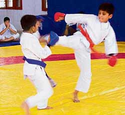 Two young karate players in action during selection trials at Ambala on Thursday. 