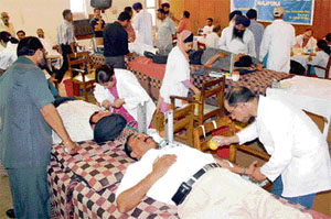 Volunteers donate blood at a camp organised by the Rajpura Press Club at Rajpura.