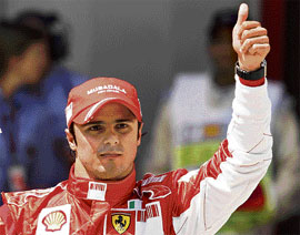 Ferrari�s Brazilian driver Felipe Massa gestures after taking the pole position for the Spanish Grand Prix at the Circuit de Catalunya in Montmelo, outside Barcelona, on Saturday. The Formula One race will be held on Sunday.