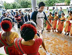 A Bangladeshi woman gets ready to shake hands with Yuvraj Singh at the entrance to the Ruhul Amin Stadium in Chittagong on Monday.