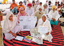 Gurnam Kaur (right), widow of freedom fighter Tara Singh, on an indefinite fast near the DC’s office in Moga on Tuesday.