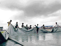 Ground staff at work at the Ruhul Amin Stadium in Chittagong on Sunday.