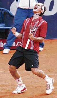 Switzerland�s Roger Federer rejoices after beating Spain�s Rafael Nadal in the Hamburg Masters final on Sunday.
