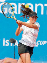 Aravane Rezai of France returns the ball to Venus Williams of the US during their match at the Istanbul Cup on Wednesday.