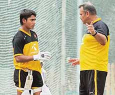 Mohammad Ashraful (left) of Bangladesh listens to team coach Dev Whatmore during a practice session at the Sher-e-Bangla National Cricket Stadium at Mirpur in Dhaka on Thursday. 