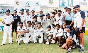 Indian players with the trophy after winning the Test series against Bangladesh at the Sher-e-Bangla Cricket Stadium at Mirpur in Dhaka on Sunday.