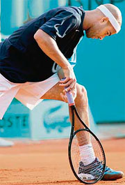 James Blake of the US reacts after losing a point to Croatian player Ivo Karlovic during their French Open first round match in Paris on Tuesday.