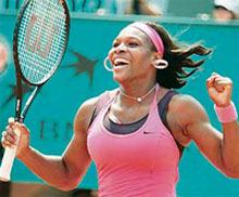Serena Williams of the US reacts after beating Dinara Safina of Russia in the fourth round of the French Open in Paris on Sunday. Williams won 6-2, 6-3.