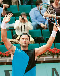 Carlos Moya of Spain acknowledges the crowd after beating Swede Jonas Bjorkman in the fourth round of the French Open in Paris on Monday. Moya won 7-6, 6-2, 7-5.