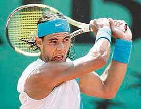 Spain�s Rafael Nadal returns the ball to compatriot Carlos Moya at the French Open in Paris on Wednesday. Nadal won 6-4, 6-3, 6-0. 
