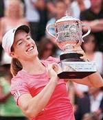 Belgium�s Justine Henin holds the trophy after beating Serbia�s Ana Ivanovic in the French Open final at Roland Garros in Paris