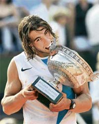 Spain�s Rafael Nadal with the trophy after beating Switzerland�s Roger Federer during their French Open final at Roland Garros in Paris