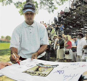 Jeev Milkha Singh signs autographs during the practice round for the 107th US Open Golf Championship at the Oakmont Country Club in Pennsylvania on Wednesday.