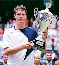 Czech Republic�s Tomas Berdych holds the trophy after beating Cypriot Marcos Baghdatis in the final of the ATP tennis tournament at the Gerry-Weber-Stadium in Halle, Germany