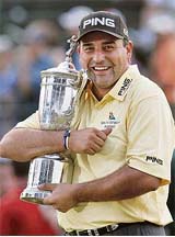 Argentina�s Angel Cabrera clutches his prized possession after winning the US Open Golf Championship at the Oakmont Country Club in Pennsylvania on Sunday. 
