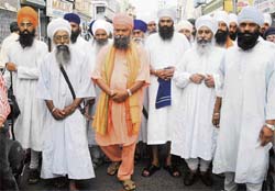 Members of the Punjab Sant Samaj hold a peace march in protest against the Dera Sacha Sauda chief in Patiala
