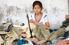 A girl works at a spinning mill in Panipat