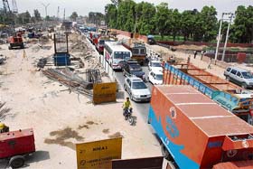 Vehicles move at a snail�s pace on National Highway No. 1 in Panipat where the construction of a flyover is underway
