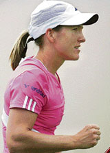 Belgium�s Justine Henin celebrates after beating France�s Marion Bartoli in the semifinal of the International Women�s Tennis Open in Eastbourne on Friday.